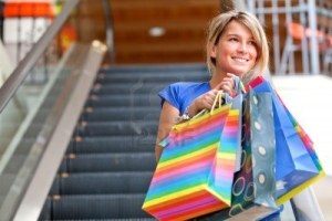 6608758-shopping-woman-smiling-on-the-escalators-at-a-mall